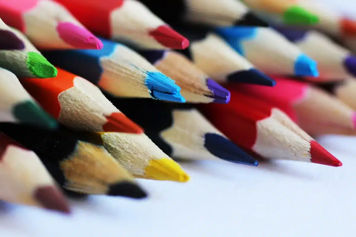 Vintage 1990s school supplies including backpacks, notebooks, pens, and erasers in bright neon colors
