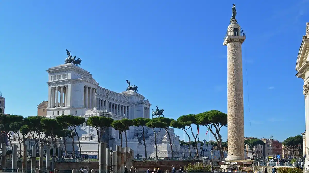 Tourists strolling near a Roman piazza under clear September skies