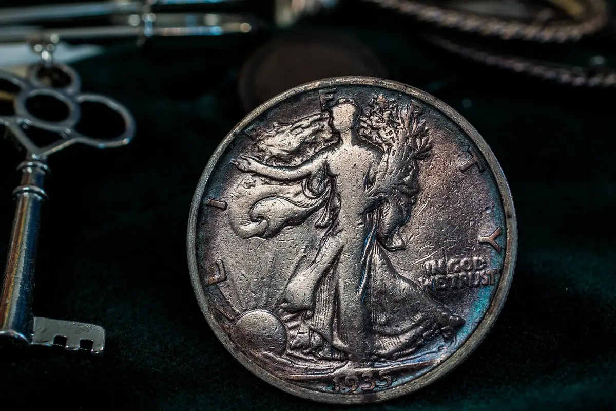 Old legal documents and vintage coins illustrating historic currency laws