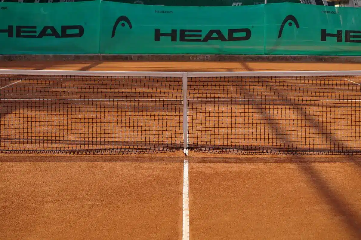 Player hitting powerful baseline forehand during a match